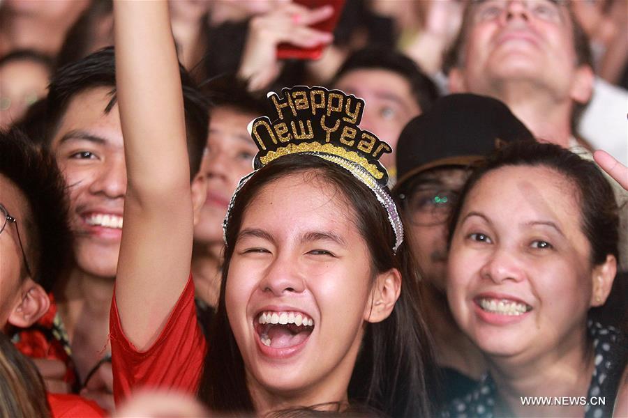Revelers cheer during a New Year celebration at a park in Quezon City, the Philippines, on Jan. 1, 2019. (Xinhua/Rouelle Umali)