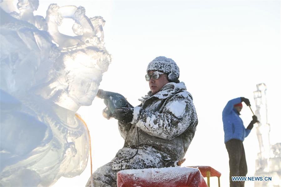 Contestants carve ice sculptures during an international ice sculpture competition in Harbin, capital of northeast China\'s Heilongjiang Province, Jan. 2, 2019. A total of 16 teams from 12 countries and regions took part in the competition. (Xinhua/Wang Song)