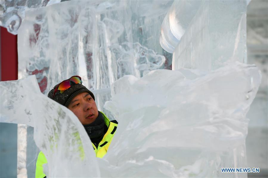 A contestant carves an ice sculpture during an international ice sculpture competition in Harbin, capital of northeast China\'s Heilongjiang Province, Jan. 3, 2019. (Xinhua/Wang Song)