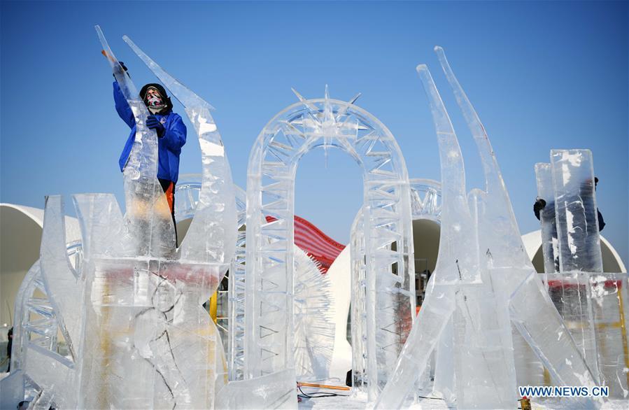 Contestants make an ice sculpture during an international ice sculpture competition in Harbin, capital of northeast China\'s Heilongjiang Province, Jan. 3, 2019. (Xinhua/Wang Jianwei)