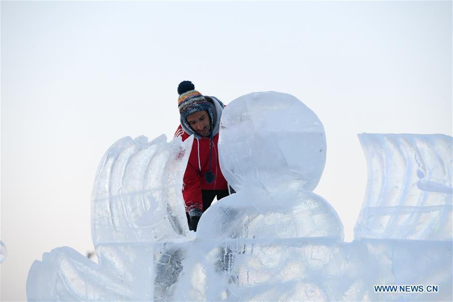 A contestant carves an ice sculpture during an international ice sculpture competition in Harbin, capital of northeast China\'s Heilongjiang Province, Jan. 3, 2019. (Xinhua/Wang Song)