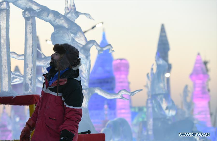 A contestant carves an ice sculpture during an international ice sculpture competition in Harbin, capital of northeast China\'s Heilongjiang Province, Jan. 3, 2019. (Xinhua/Wang Song)