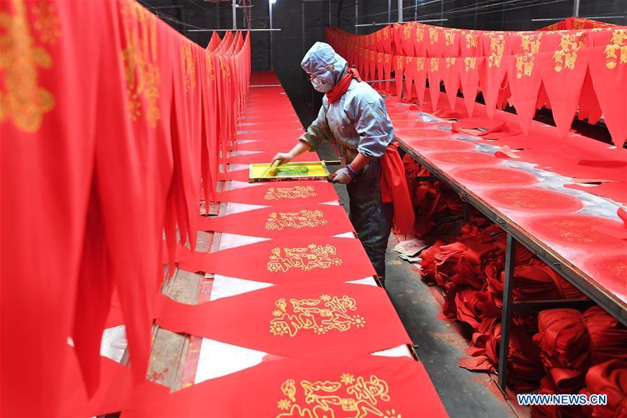 A villager works in a lantern workshop for the upcoming peak sales season of Spring Festival in Jifeng Town of Jishan County in Yuncheng, north China\'s Shanxi Province, Jan. 3, 2019. (Xinhua/Yang Chenguang)