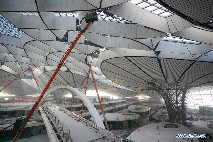 Staff members work in the Beijing Daxing International Airport under construction in Beijing, Dec 29, 2018. (Photo/Xinhua)