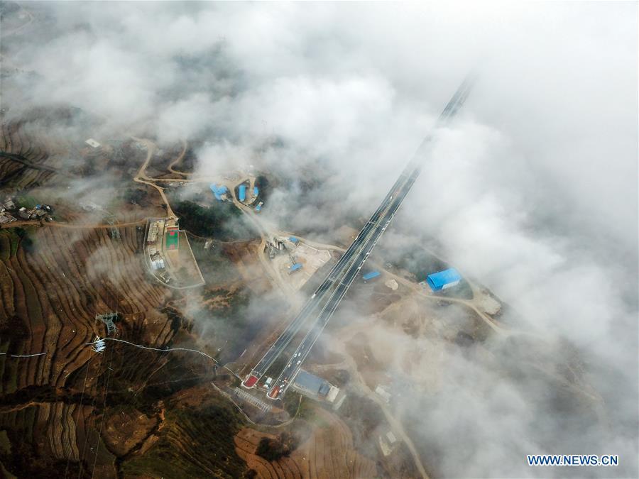 Aerial photo taken on Dec. 19, 2018 shows a part of the Liupanshui-Weining Highway in southwest China\'s Guizhou Province. The Liupanshui-Weining Highway with a highest altitude of 2,260 meters, the highest highway in the province, opened to traffic on Thursday. (Xinhua/He Huan)