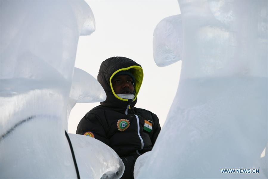 A contestant carves an ice sculpture during an international ice sculpture competition in Harbin, capital of northeast China\'s Heilongjiang Province, Jan. 3, 2019. (Xinhua/Wang Song)
