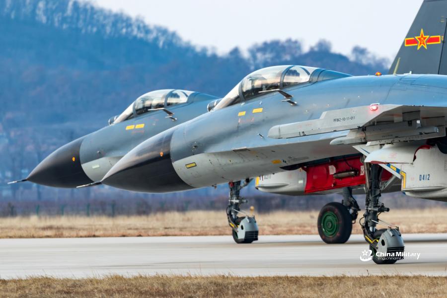 J-11B fighter jets attached to an aviation brigade of the air force with the PLA Northern Theater Command taxi on the runway during a round-the-clock flight training exercise on January 3, 2019. (Photo/eng.chinamil.com.cn)