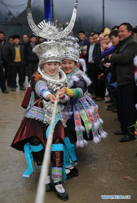Girls of Miao ethnic group take part in a tug of war in Rongshui, Liuzhou City of south China\'s Guangxi Zhuang Autonomous Region, Jan. 5, 2019. Local Miao people celebrated their traditional New Year in various ways. (Xinhua/Long Tao)