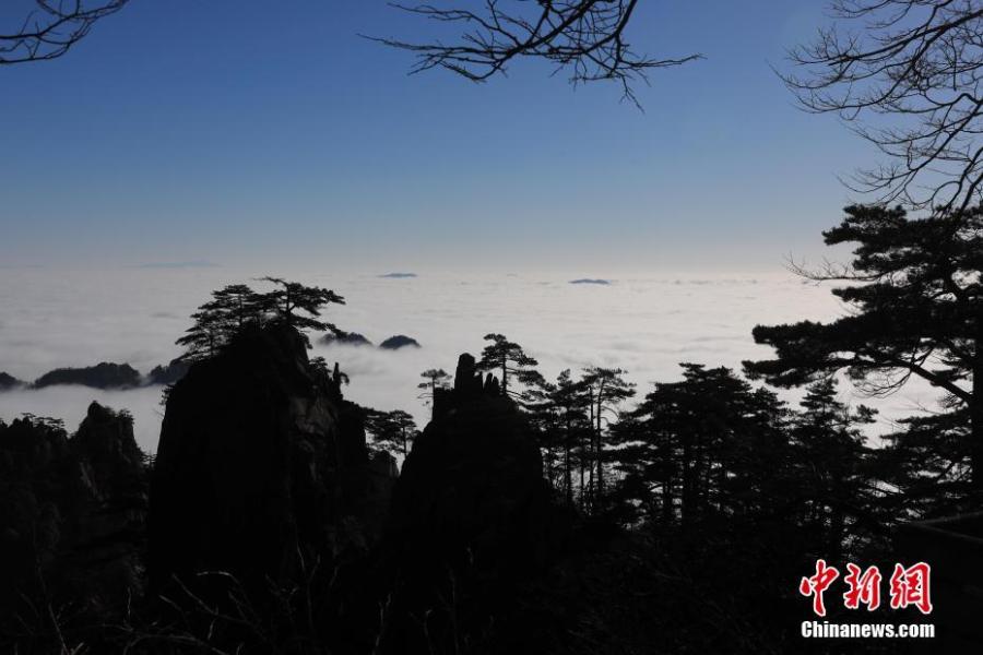 A sea of clouds after rain sweeps over Mount Huangshan in Anhui Province on Jan. 6, 2018. A UNESCO World Heritage site, the area is well known for its scenery, sunsets, peculiarly-shaped granite peaks, and pine trees. (Photo: China News Service/Shi Guangde)