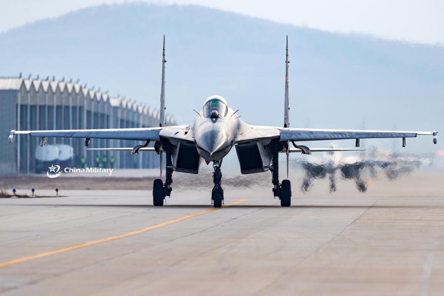 J-11B fighter jets attached to an aviation brigade of the air force with the PLA Northern Theater Command taxi on the flightline during a round-the-clock flight training exercise on January 3, 2019.  (Photo/eng.chinamil.com.cn)