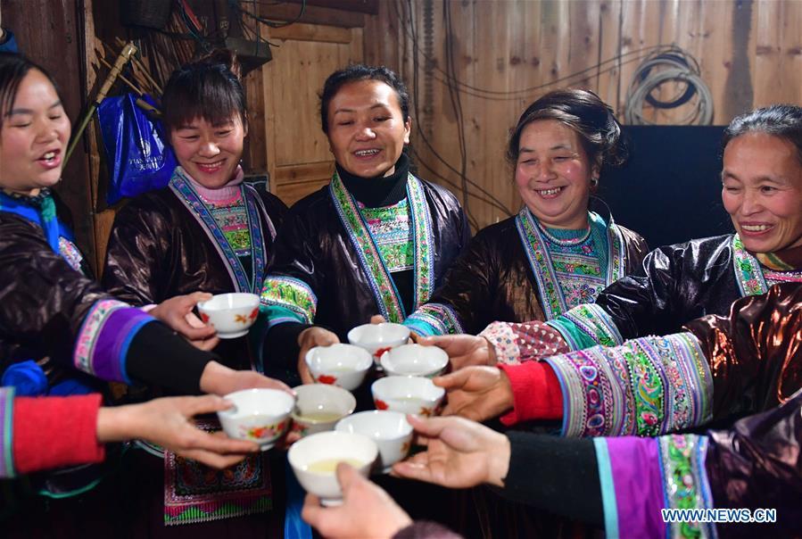 Villagers drink wine to wish for good luck during a get-together in Rongshui, Liuzhou City of south China\'s Guangxi Zhuang Autonomous Region, Jan. 5, 2019. Local Miao people celebrated their traditional New Year in various ways. (Xinhua/Huang Xiaobang)