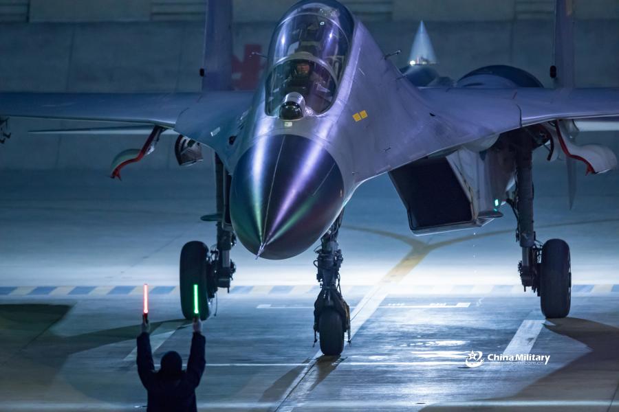 A J-11B fighter jet attached to an aviation brigade of the air force with the PLA Northern Theater Command taxis on the runway after landing after the round-the-clock flight training exercise on January 3, 2019.  (Photo/eng.chinamil.com.cn)