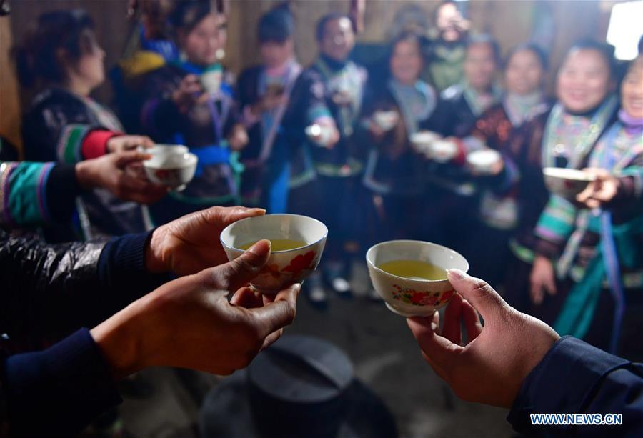 Villagers drink wine to wish for good luck during a get-together in Rongshui, Liuzhou City of south China\'s Guangxi Zhuang Autonomous Region, Jan. 5, 2019. Local Miao people celebrated their traditional New Year in various ways. (Xinhua/Huang Xiaobang)