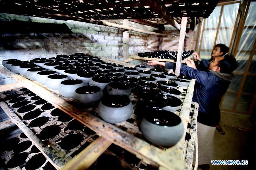 Workers make lacquerware at a workshop in Bagan, Mandalay Region of Myanmar, on Jan. 7, 2019. Lacquerware is one of Myanmar\'s traditional handicrafts and popular souvenirs for tourists. It is made of strips of bamboo, hair of horse tail and wood. (Xinhua/U Aung)