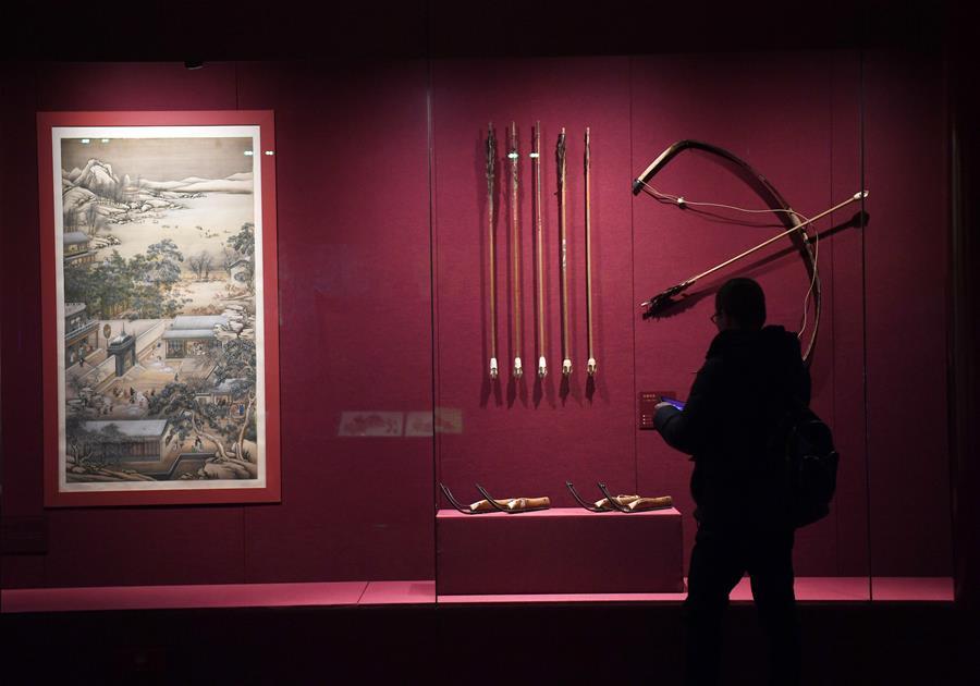 A tourist looks at exhibits displayed at the Palace Museum, also known as the Forbidden City in Beijing, capital of China, Jan. 7, 2019. In celebrating of the most magnificent of all traditional holidays, the Palace Museum presents exhibition of \