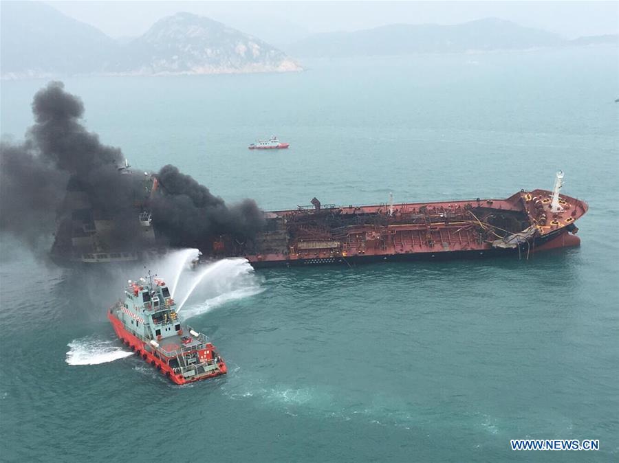 A rescue boat puts out fire that occurred on an oil tanker off Hong Kong\'s Lamma Island, Jan. 8, 2019. One person was killed, seven injured and two missing as an oil tanker exploded and caught fire Tuesday. The accident occurred at around 11:29 a.m. local time (0329 GMT) when crew members on the 140-meter-long oil tanker were trying to connect pipes with an oil barge to refuel the ship south off Lamma Island, said Yiu Men Yeung, division commander for marine and diving of Hong Kong Special Administrative Region (HKSAR) government\'s Fire Services Department (FSD). (Xinhua)