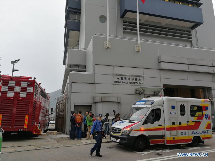 Rescuers and media workers are seen outside the Marine Police Aberdeen Base in Hong Kong, south China, Jan. 8, 2019. One person was killed, seven injured and two missing as an oil tanker exploded and caught fire Tuesday off Hong Kong\'s Lamma Island. The accident occurred at around 11:29 a.m. local time (0329 GMT) when crew members on the 140-meter-long oil tanker were trying to connect pipes with an oil barge to refuel the ship south off Lamma Island, said Yiu Men Yeung, division commander for marine and diving of Hong Kong Special Administrative Region (HKSAR) government\'s Fire Services Department (FSD). (Xinhua/Wu Xiaochu)