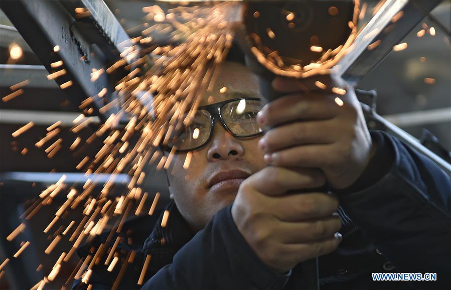 Zhu Yue works on building his \