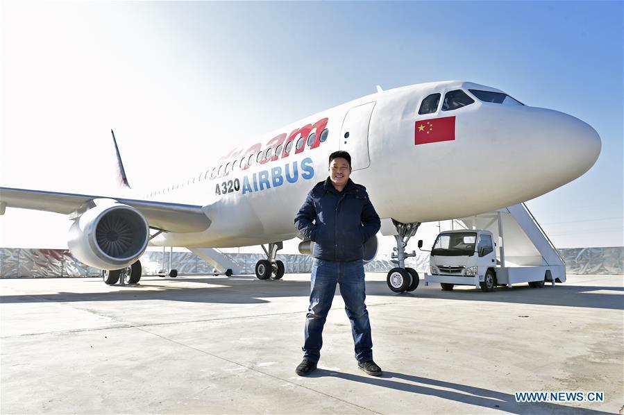 Zhu Yue poses with his \