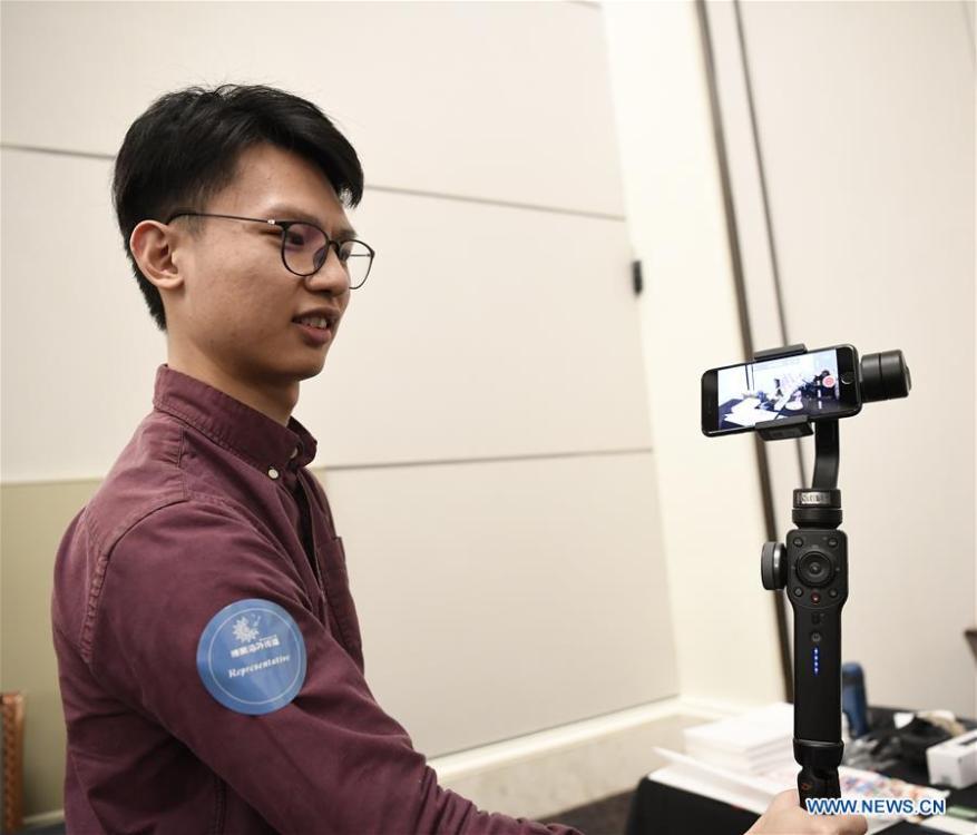 A new handheld gimbal is seen during a press preview held by members of the Chinese corps attending the 2019 Consumer Electronics Show (CES) in Las Vegas, the United States, Jan. 7, 2019. The 2019 Consumer Electronics Show (CES) opens on Tuesday. (Xinhua/Liu Jie)