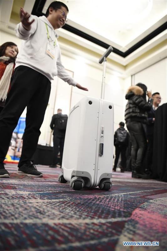 A smart carry-on suitcase is seen during a press preview held by members of the Chinese corps attending the 2019 Consumer Electronics Show (CES) in Las Vegas, the United States, Jan. 7, 2019. The 2019 Consumer Electronics Show (CES) opens on Tuesday. (Xinhua/Liu Jie)