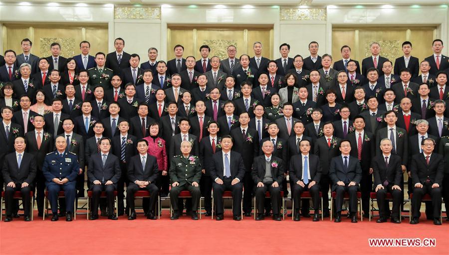 Chinese President Xi Jinping, also general secretary of the Communist Party of China (CPC) Central Committee and chairman of the Central Military Commission, and other leaders, including Li Keqiang, Wang Huning, and Han Zheng, all members of the Standing Committee of the Political Bureau of the CPC Central Committee, pose for a group photo with representatives of the winners before an annual ceremony to honor distinguished scientists, engineers, and research achievements at the Great Hall of the People in Beijing, capital of China, Jan. 8, 2019. (Xinhua/Xie Huanchi)