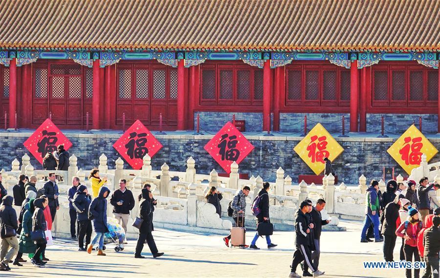 People visit the Palace Museum, also known as the Forbidden City, in Beijing, capital of China, Jan. 8, 2019. The Palace Museum presents exhibition of \