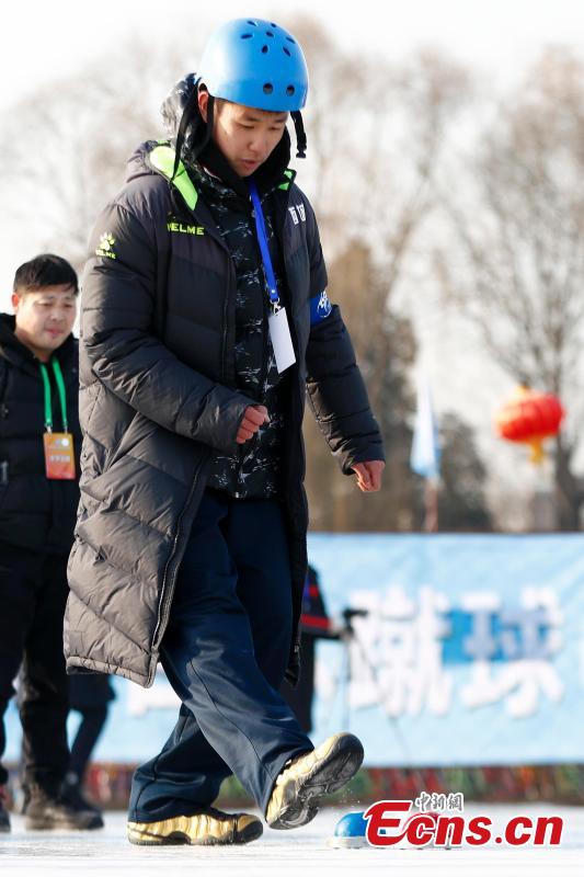 Players compete in cuju, an ancient Chinese football game, during the first Beijing Winter Games held at Houhai Ice Arena in Beijing, Jan. 10, 2019. More than 180 participants on 16 teams representing all districts in the capital city joined the competition. Playing cuju on ice has long been a traditional folk sport in Beijing. (Photo: China News Service/Fu Tian)