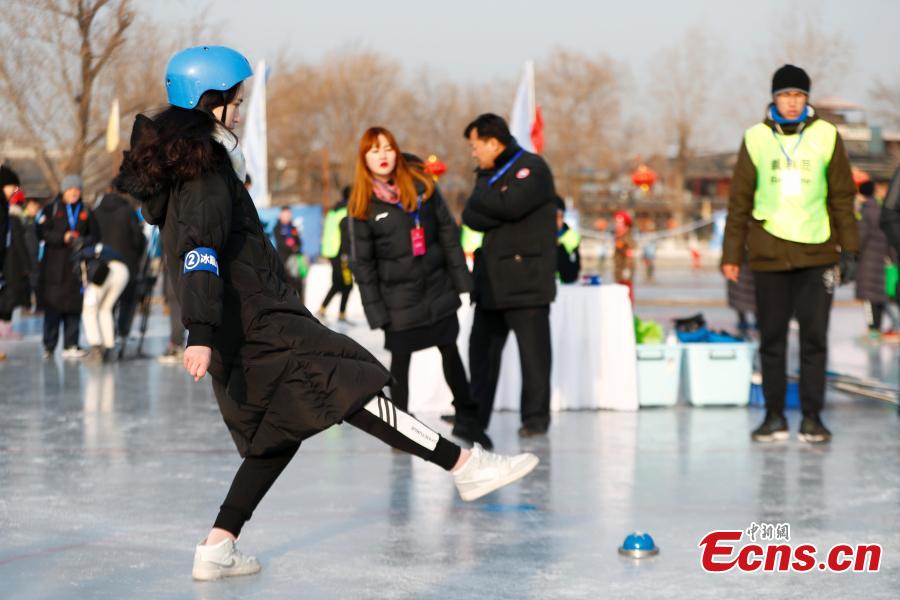 Players compete in cuju, an ancient Chinese football game, during the first Beijing Winter Games held at Houhai Ice Arena in Beijing, Jan. 10, 2019. More than 180 participants on 16 teams representing all districts in the capital city joined the competition. Playing cuju on ice has long been a traditional folk sport in Beijing. (Photo: China News Service/Fu Tian)
