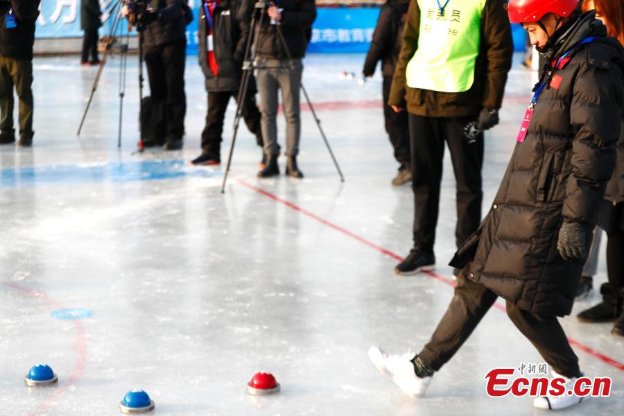 Players compete in cuju, an ancient Chinese football game, during the first Beijing Winter Games held at Houhai Ice Arena in Beijing, Jan. 10, 2019. More than 180 participants on 16 teams representing all districts in the capital city joined the competition. Playing cuju on ice has long been a traditional folk sport in Beijing. (Photo: China News Service/Fu Tian)
