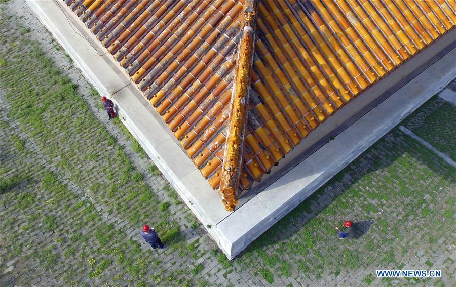 Technical staff check lightning protection facilities at the eastern royal tombs of the Qing Dynasty (1644-1911), a historic building complex, in Zunhua City of Tangshan, north China\'s Hebei Province, May 8, 2018. The National Cultural Heritage Administration will work out a plan to better protect cultural relics and speed up the creation of a safety oversight platform in 2019. Stressing the importance of such protection, Liu Yuzhu, head of the administration, said lax enforcement is a prominent problem that endangers cultural relics, at a meeting attended by cultural heritage administrators nationwide. (Xinhua/Liu Mancang)
