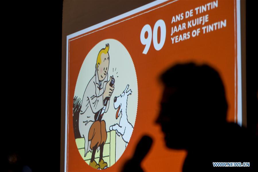 A comic artist attends a press conference on the 90th anniversary of \