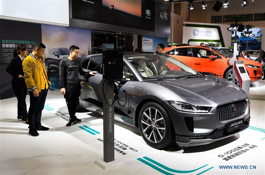 Visitors view a new energy car of Jaguar at Haikou New Energy Vehicle Exhibition in Haikou, south China\'s Hainan Province, Jan. 10, 2019. A total of 197 new energy vehicles were displayed at the exhibition. (Xinhua/Yang Guanyu)