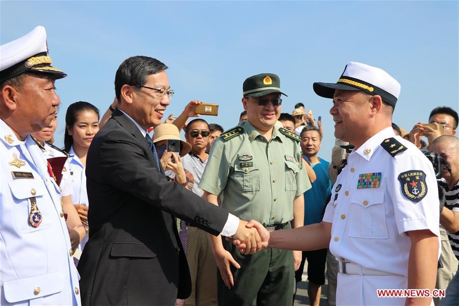Rear Admiral Xu Haihua (R), commander of the 30th fleet of Chinese navy escort, shakes hands with Chinese Ambassador to Cambodia Wang Wentian during a welcoming ceremony at Sihanoukville Autonomous Port, Cambodia, Jan. 9, 2019. The 30th Chinese naval escorting fleet, composed of missile frigates \