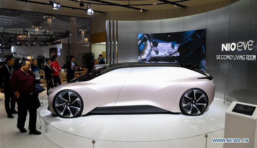 Visitors view the concept car EVE from Chinese electric automaker Nio at Haikou New Energy Vehicle Exhibition in Haikou, south China\'s Hainan Province, Jan. 10, 2019. A total of 197 new energy vehicles were displayed at the exhibition. (Xinhua/Yang Guanyu)