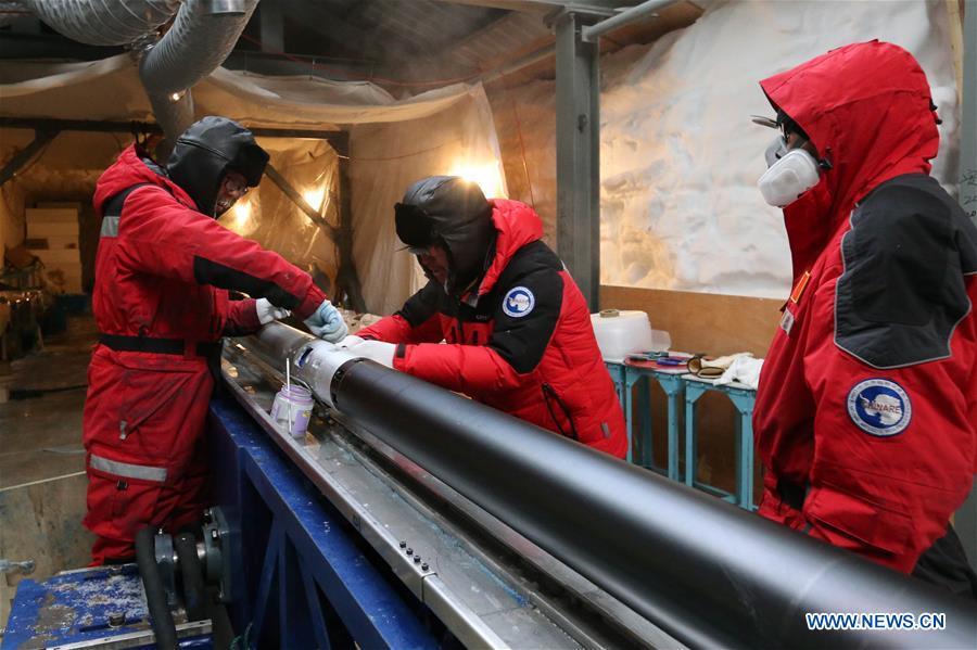 Members of one of two inland expedition teams on China\'s 35th Antarctic expedition maintain the drilling equipment at the Kunlun Station in Antarctica, Jan. 12, 2019. (Xinhua/Liu Shiping)