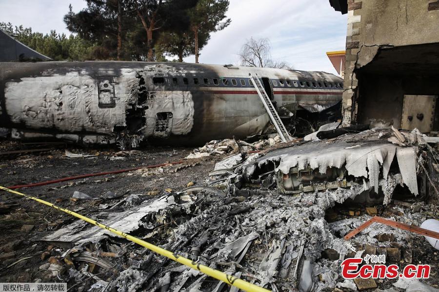 A picture taken on January 14, 2019 shows a Boeing 707 cargo plane that reportedly crashed into a residential complex near the Iranian capital Tehran with more than 10 people onboard. The plane overshot the runway during its landing, Iran\'s aviation organisation spokesman Reza Jafarzadeh told state broadcaster IRIB. (Photo/Agencies)