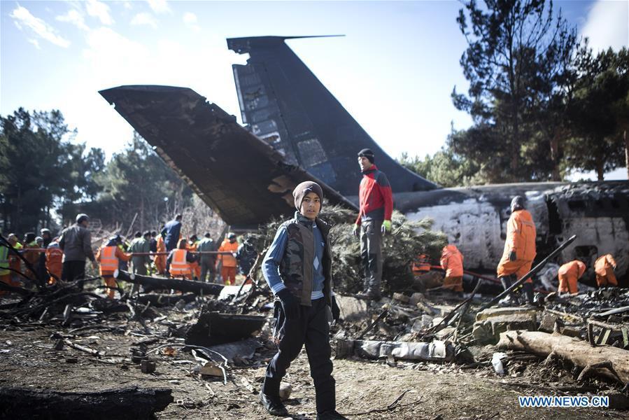A boy walks on the site of a Boeing 707 plane crash in Karaj, Iran, Jan. 14, 2019. At least 15 people were killed on Monday in the crash. (Xinhua/Ahmad Halabisaz)