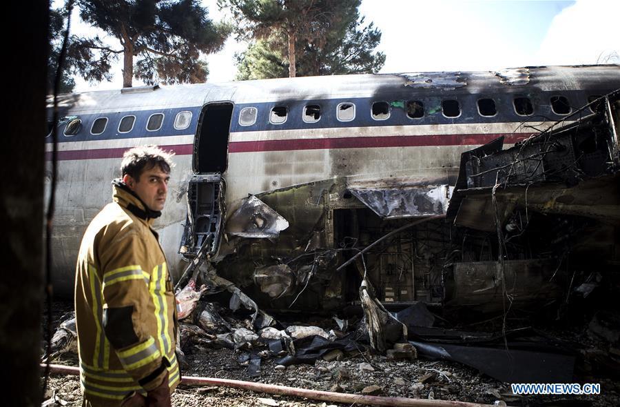 A rescuer stands at the crash site of a Boeing 707 plane in Karaj, Iran, Jan. 14, 2019. At least 15 people were killed on Monday in the crash. (Xinhua/Ahmad Halabisaz)