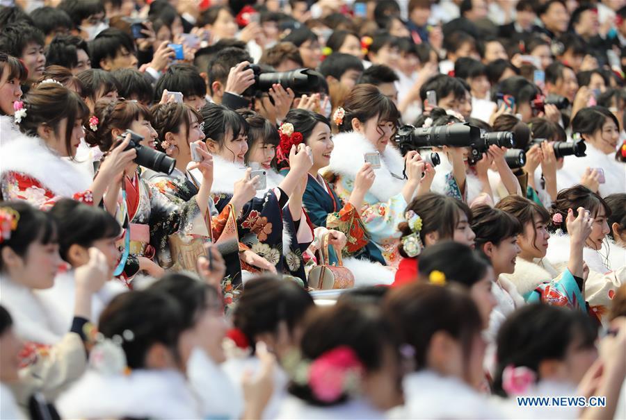 Japanese boys and girls dressed up celebrate Coming of Age together at Tokyo Disneyland in Chiba, Japan, Jan. 14, 2019. People who turned 20-year-old took part in the annual Coming of Age Day ceremony in Japan on Monday. (Xinhua/Du Xiaoyi)
