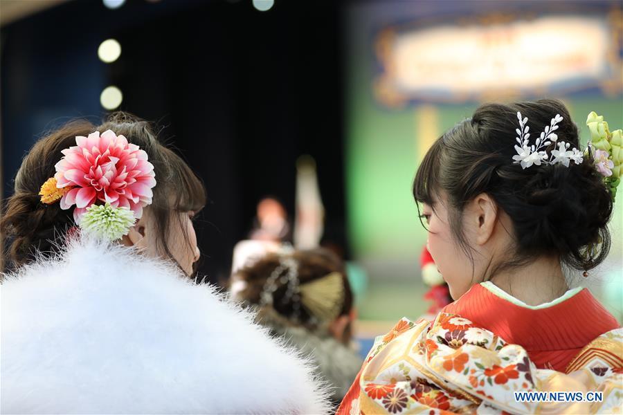 Japanese girls dressed up celebrate Coming of Age together at Tokyo Disneyland in Chiba, Japan, Jan. 14, 2019. People who turned 20-year-old took part in the annual Coming of Age Day ceremony in Japan on Monday. (Xinhua/Du Xiaoyi)
