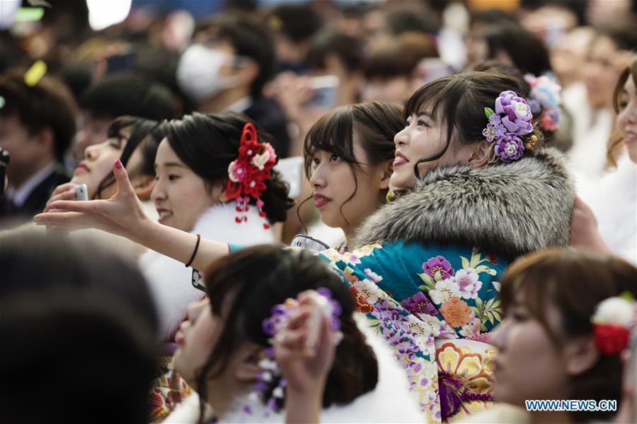 Japanese girls dressed up celebrate Coming of Age together at Tokyo Disneyland in Chiba, Japan, Jan. 14, 2019. People who turned 20-year-old took part in the annual Coming of Age Day ceremony in Japan on Monday. (Xinhua/Du Xiaoyi)