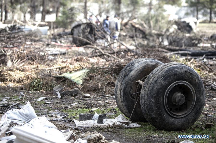 Rescuers work at the crash site of a Boeing 707 plane in Karaj, Iran, Jan. 14, 2019. At least 15 people were killed on Monday in the crash. (Xinhua/Ahmad Halabisaz)