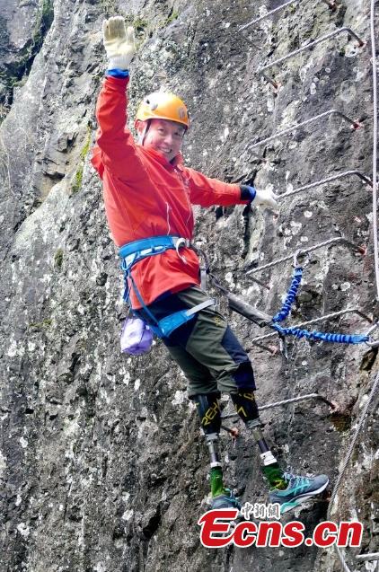 Double amputee Xia Boyu attempts a via ferrata climbing route at Shenxianju, a geological site known for its cliffs and waterfalls, in Taizhou City, East China\'s Zhejiang Province, Jan. 14, 2019. A via ferrata is a protected climbing route. Xia became a double amputee after suffering severe frostbite in both feet while attempting to climb Mount Qomolangma in 1975. The 70 year old scaled the world\'s highest peak as the first double amputee climber from the Nepali side on May 14, 2018. (Photo: China News Service/Ying Jianfei)