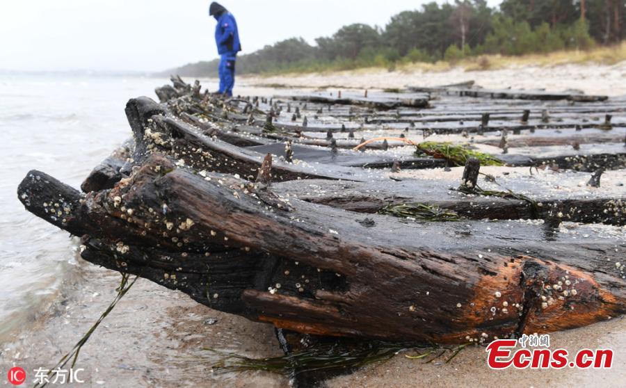 Photo taken on Jan. 15, 2019 shows the storm of the past few days has exposed an old shipwreck on the coast of the German island of Rügen. During the two storms in January, the beach in front of Glowe lost up to one meter of its height. According to experts, it is supposed to be a merchant ship from the 18th century due to its design. (Photo/IC)