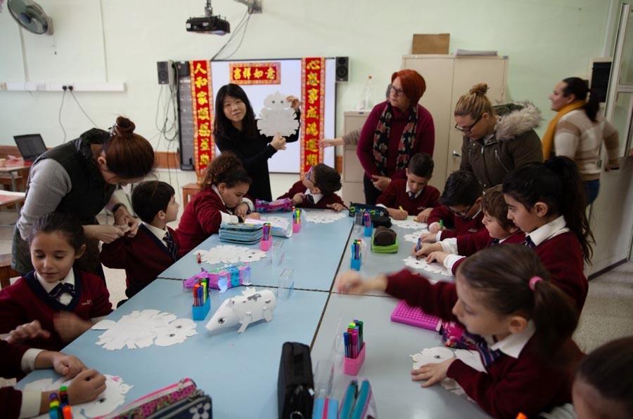 Artists from Taiwan introduce the Chinese zodiac to students at a primary school in Kalkara, Malta, Jan. 10, 2019. China assigns an animal and its reputed attributes to each year in a repeating 12-year cycle, with 2019 the Year of the Pig. A new zodiac animal exhibition is underway at the China Cultural Center in Malta through Jan. 25. (Photo/Chinaculture.org)