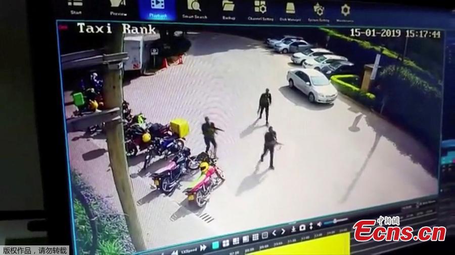 Heavily armed attackers walk through the Nairobi hotel compound in this grab taken from security camera footage released to the local media. Kenyan security forces have killed all the Somali militants who stormed an upscale Nairobi hotel compound, taking at least 21 lives and forcing hundreds of people into terrifying escapes, the government said on Wednesday. (Photo/Agencies)