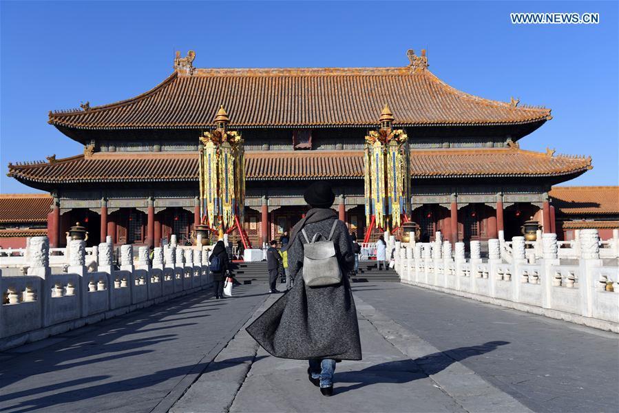 Longevity lanterns are installed before the Qianqing Gong, or the Palace of Heavenly Purity, at the Palace Museum, also known as the Forbidden City, in Beijing, capital of China, Jan. 21, 2019. The traditional lanterns recovered by the Palace Museum in accordance with historical archives from the Qing Dynasty (1644-1911) are opened to the public Monday, as a part of the exhibition of \