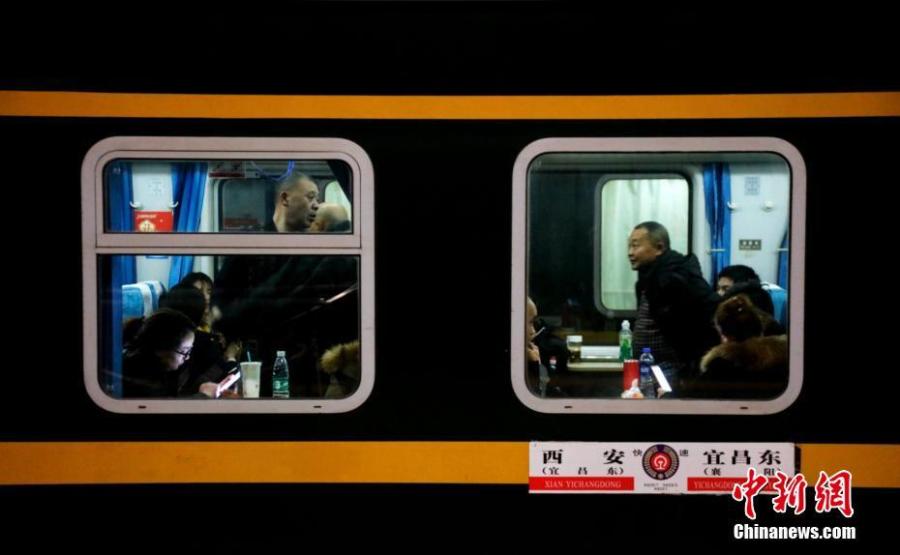 Passengers are seen onboard a train at a railway station in Yichang City, Central China’s Hubei Province, Jan. 21, 2019. The Spring Festival travel rush started Monday, unleashing China\'s largest seasonal migration as families reunite for the most important traditional holiday. From Jan. 21 to March 1, nearly three billion trips will be made on China\'s transport system as people set off for family gatherings or tours. (Photo: China News Service/Huang Yuyang)