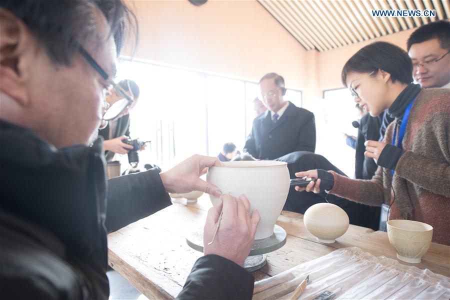 People visit the Fenghuang Mountain archaeological site park in Shangyu District of Shaoxing, east China\'s Zhejiang Province, Jan. 22, 2019. As the birthplace of celadon, Shangyu District is giving full support to revive the local celadon culture, protecting ancient relics, promoting celadon artists and boosting tourism. (Xinhua/Weng Xinyang)